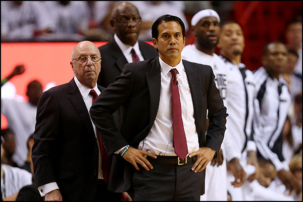 Coach spo watches from sidelines